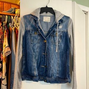 Denim jacket with gray sleeves and hood